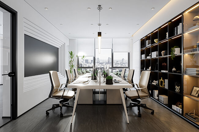 A commercial office interior with a stylish desk, chair, and computer. The walls are painted a light gray color, and the floor is made of wood. The windows are large and let in plenty of natural light. The overall space is comfortable and inviting.